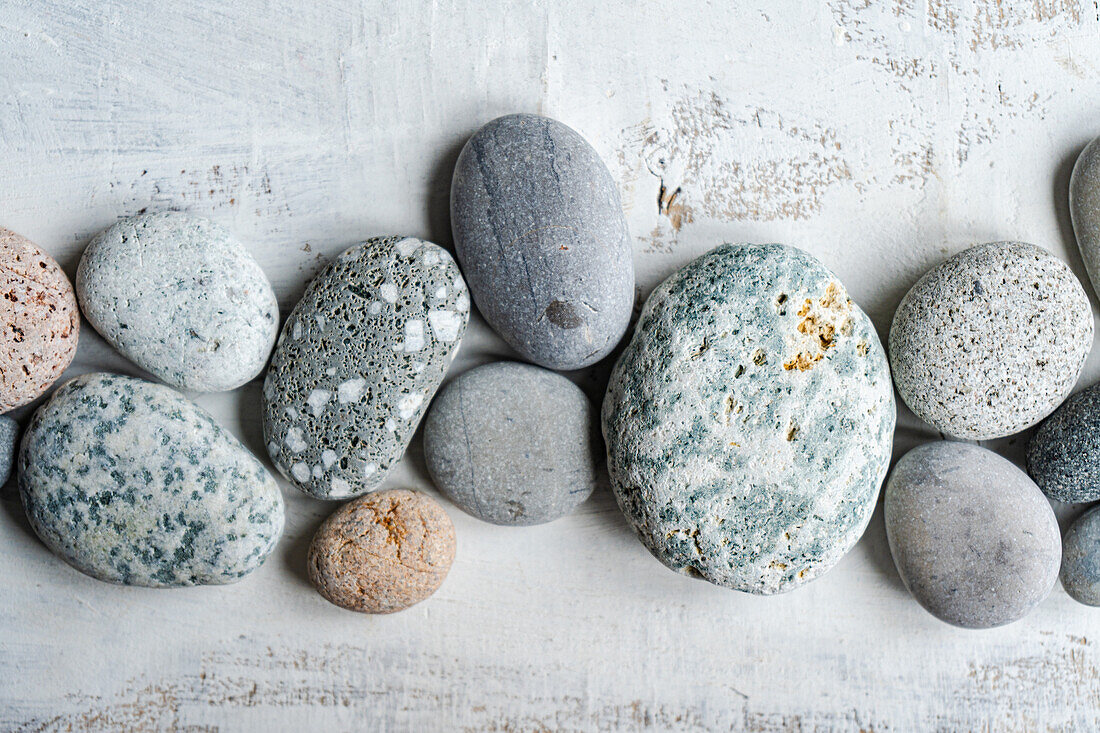 Various sea pebbles on a white background