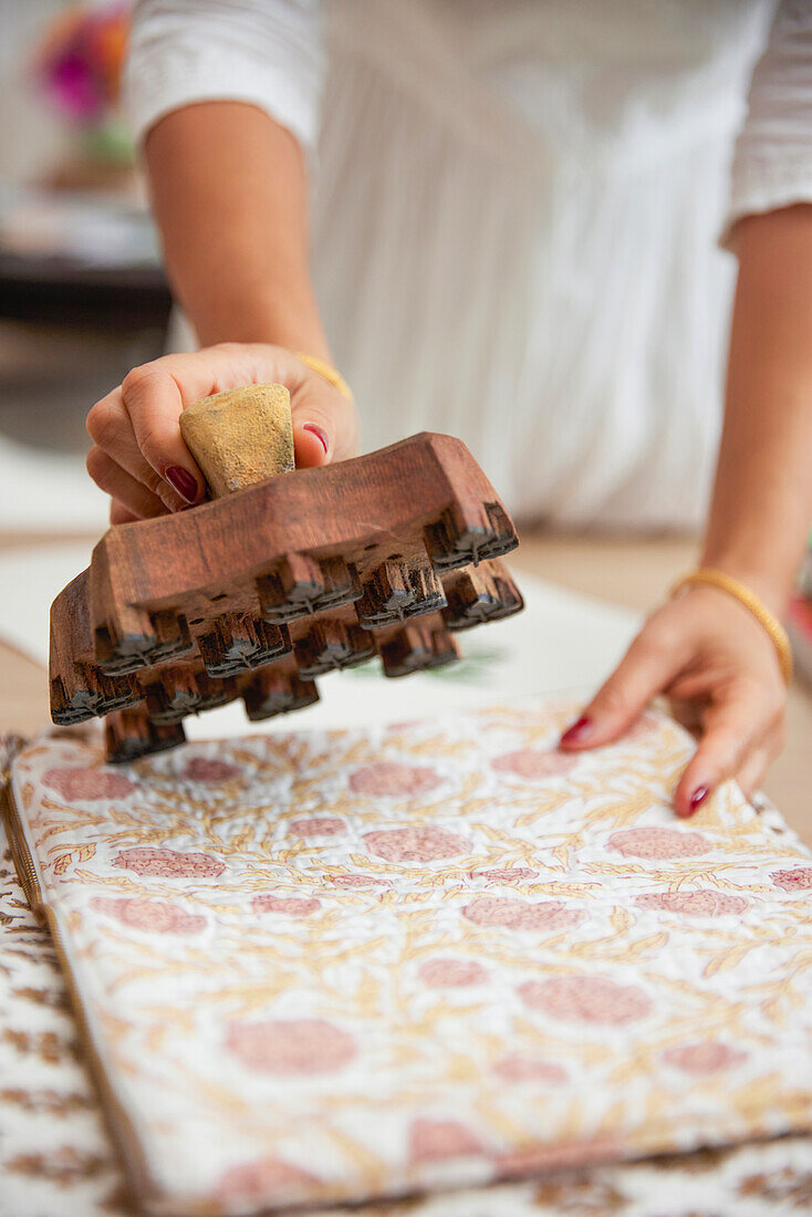 Fabric printing with wooden stamp in floral patterns