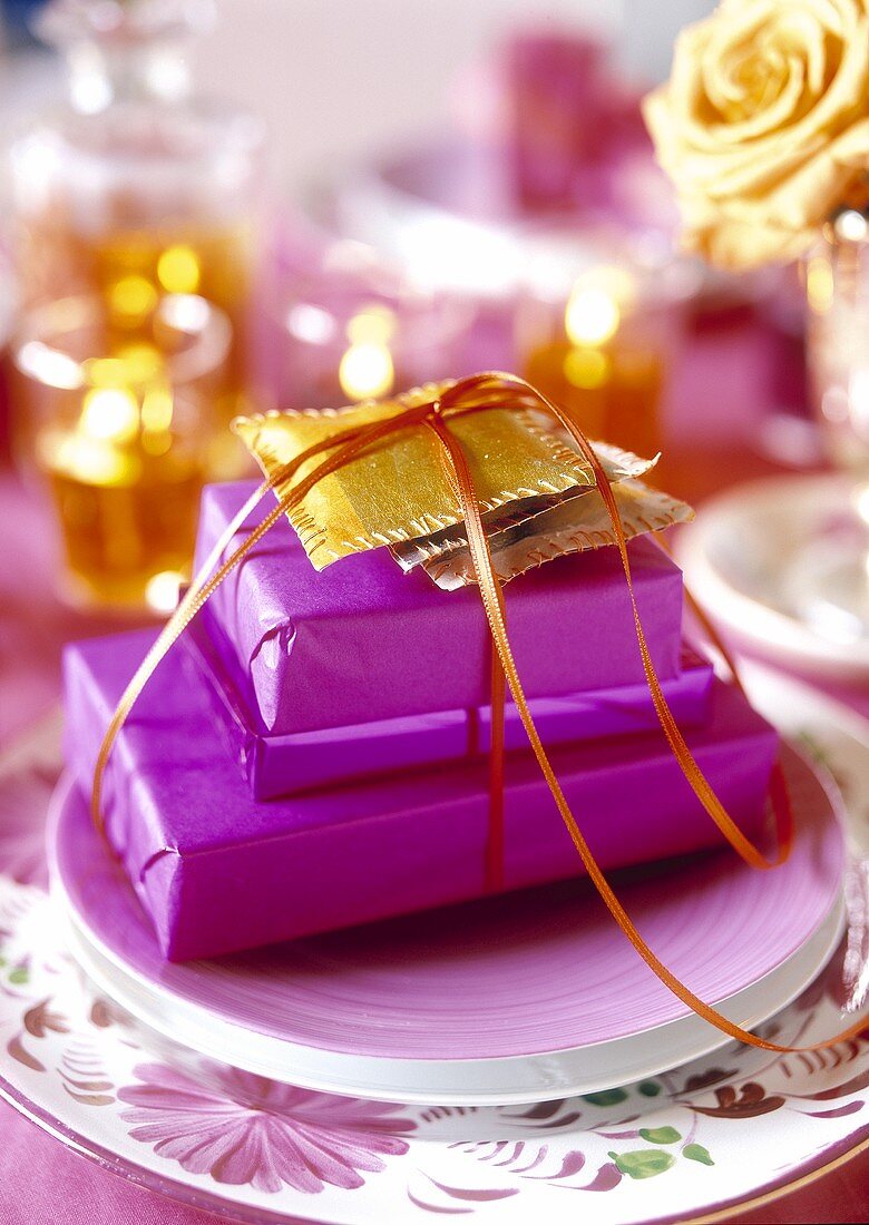 Christmas table setting in violet and gold