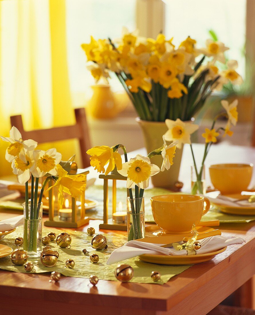 Easter table laid in yellow with daffodils