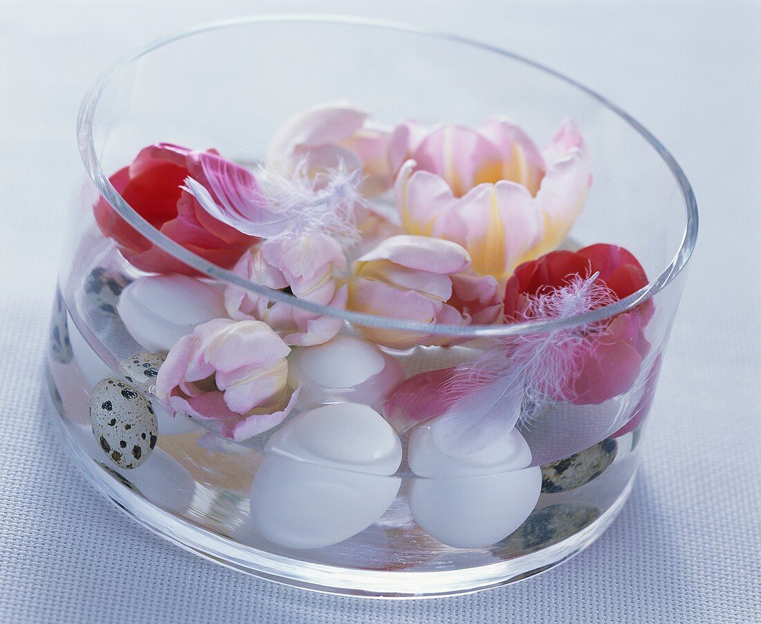 Glass bowl with hen's and quail's eggs and tulips