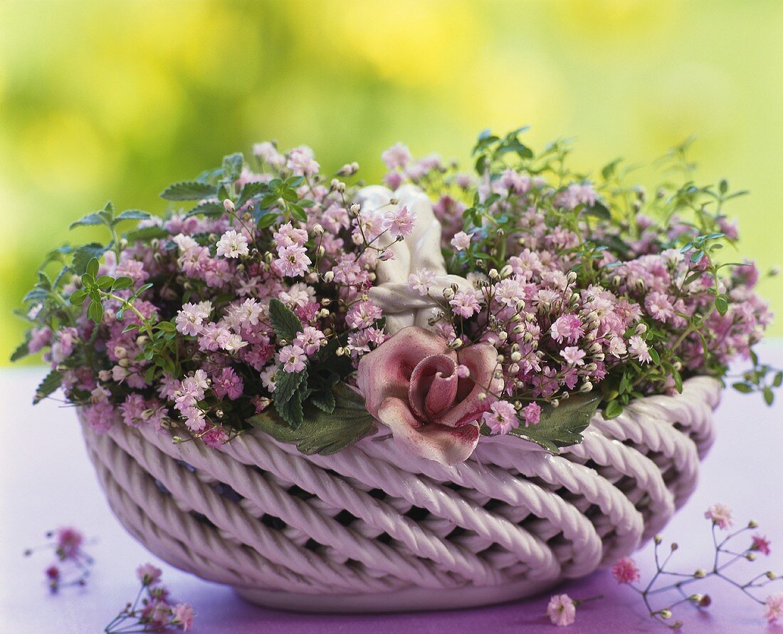 Charming china basket filled with pink gypsophila