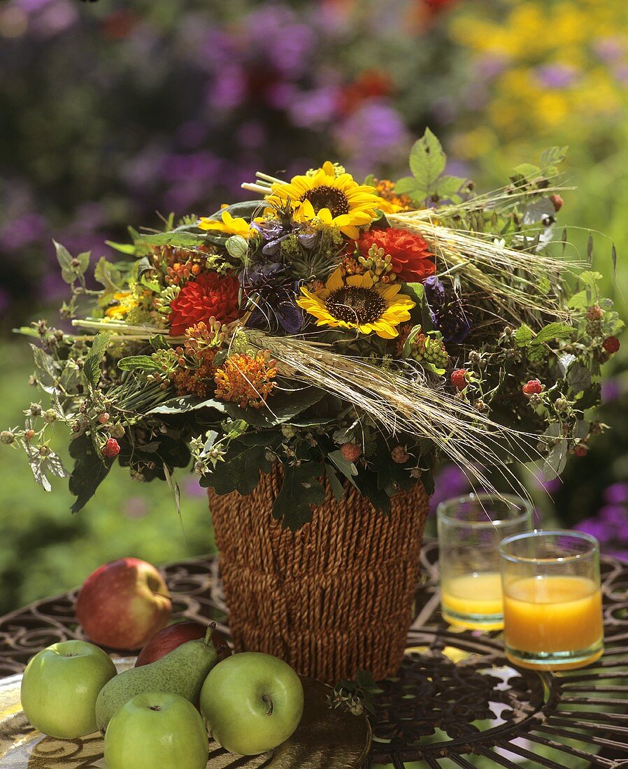 Colourful autumnal bouquet of sunflowers and cereals