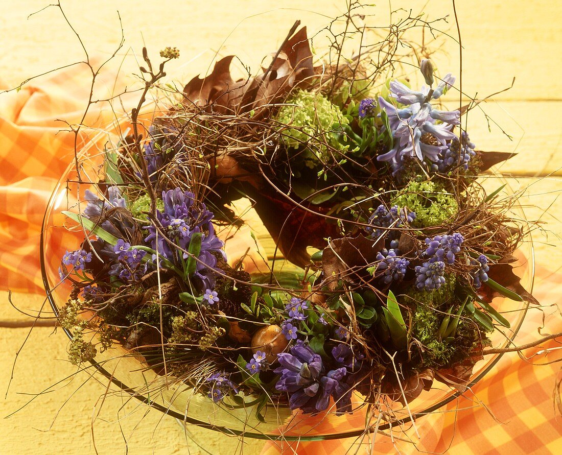 Wreath decorated with hyacinths on a glass plate
