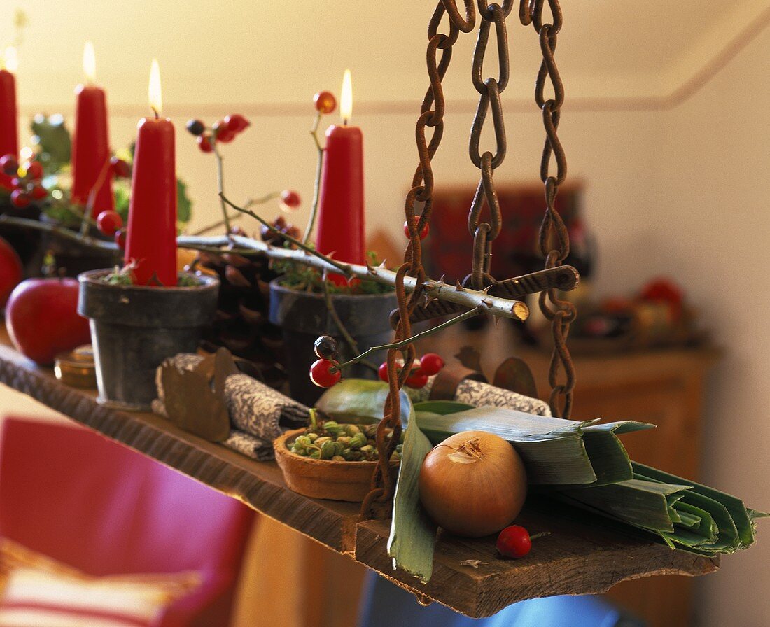 Autumn decoration: candles in terracotta pots hanging on chains