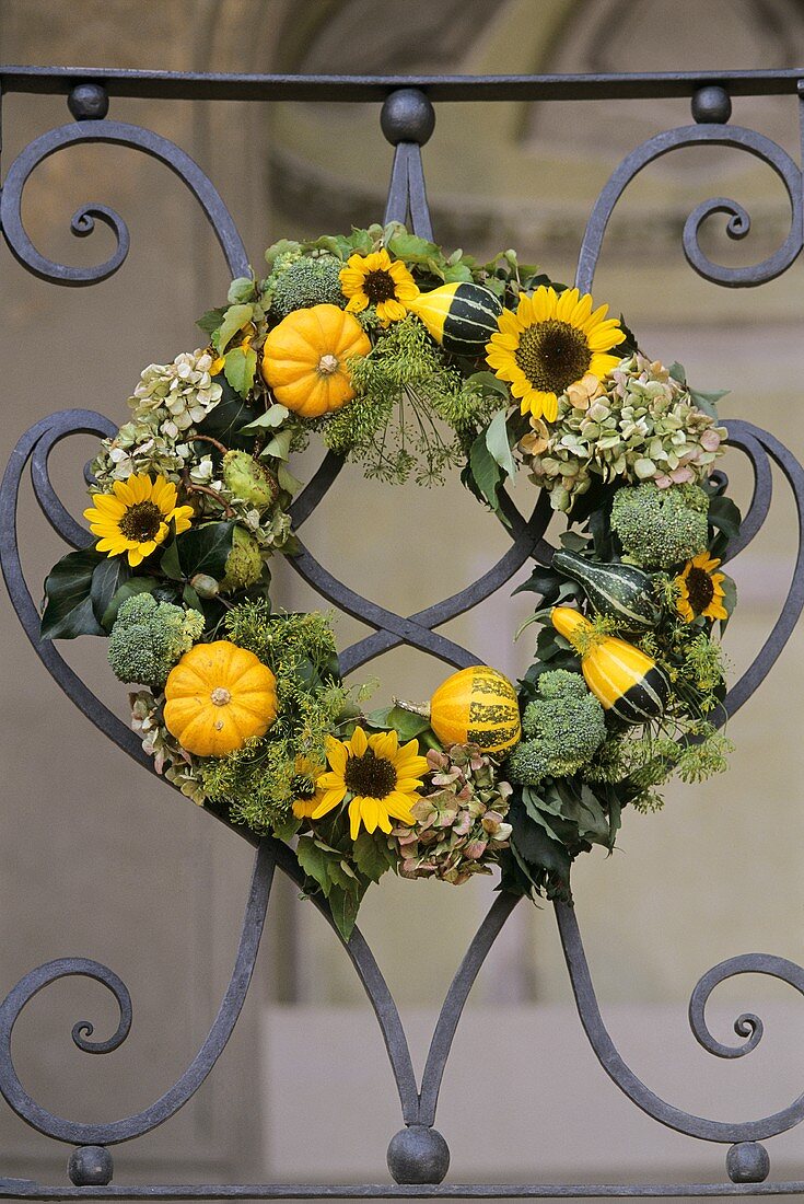 Wreath of ornamental gourds and sunflowers