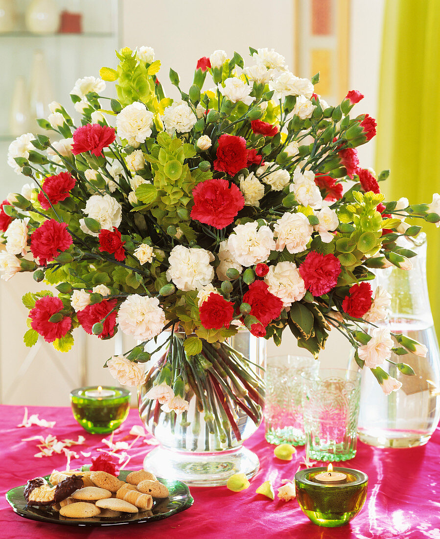 Arrangement of white and red carnations and Bells of Ireland