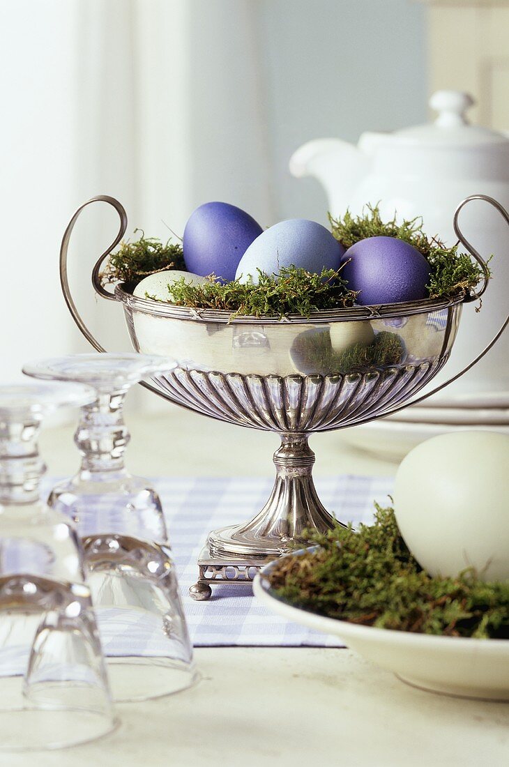 Coloured Easter eggs in a silver bowl
