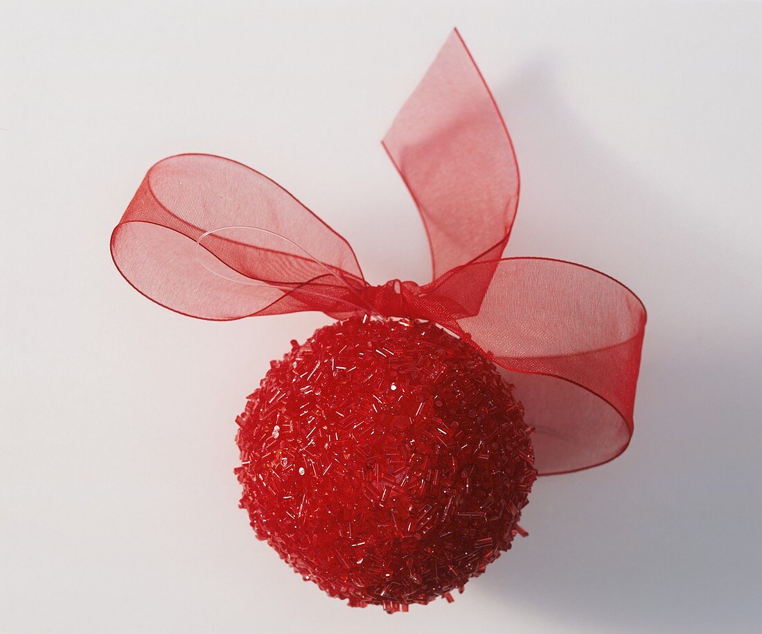 Red ball with bow