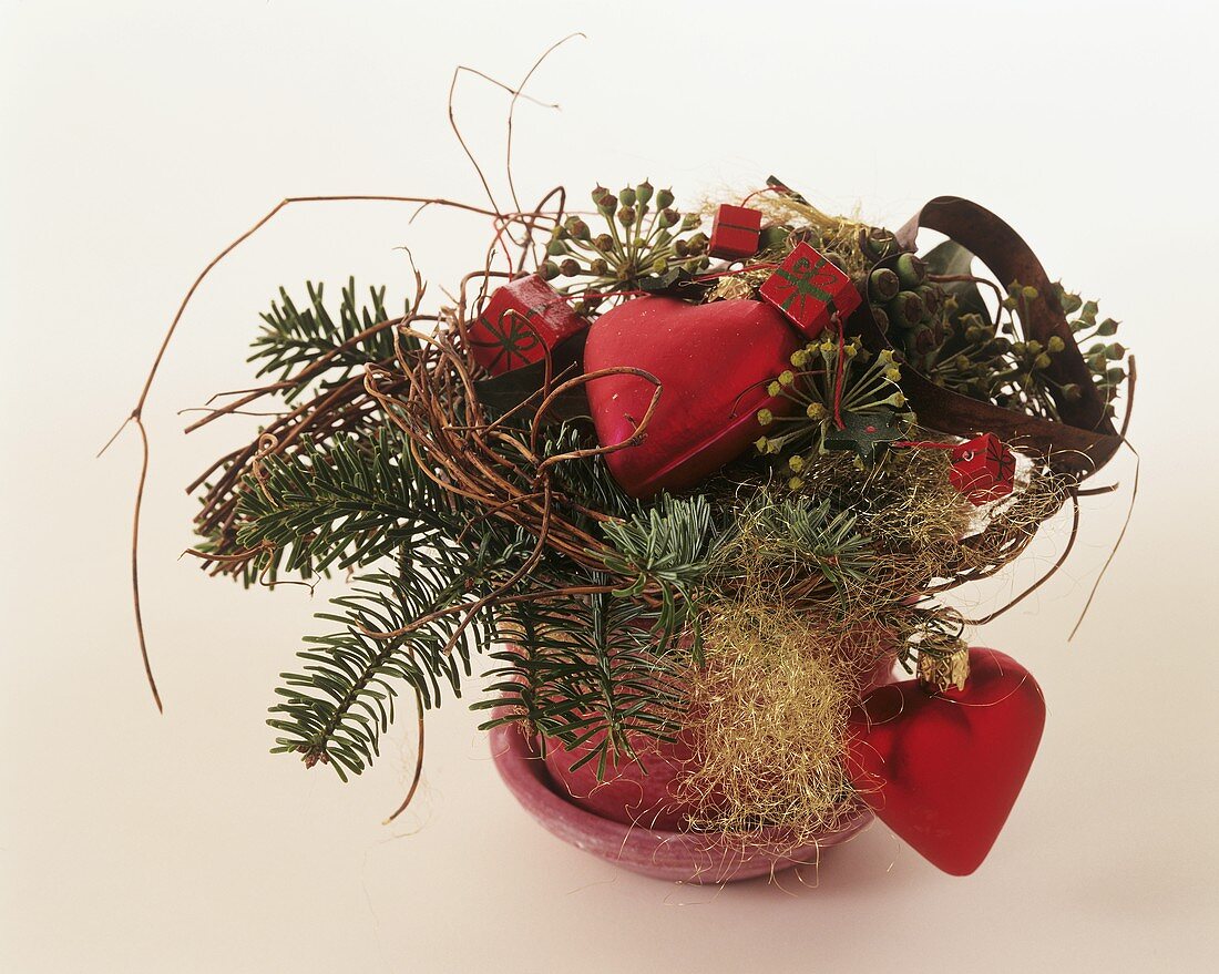 Arrangement of fir with Christmas decorations, hearts, parcels