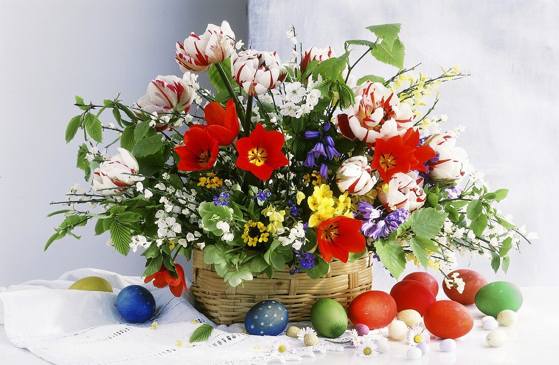 Easter bouquet with tulips in basket; Easter egg