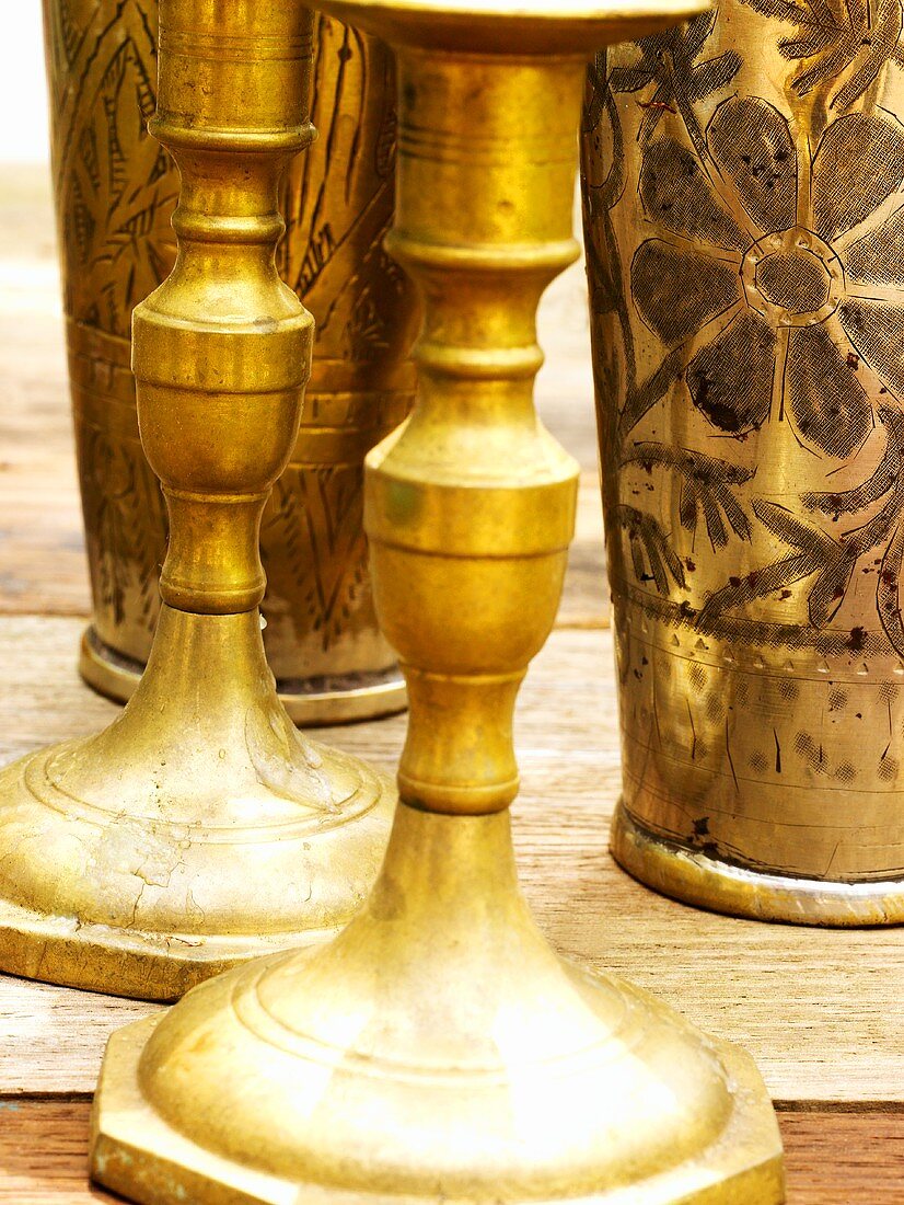 Brass candlesticks and beakers