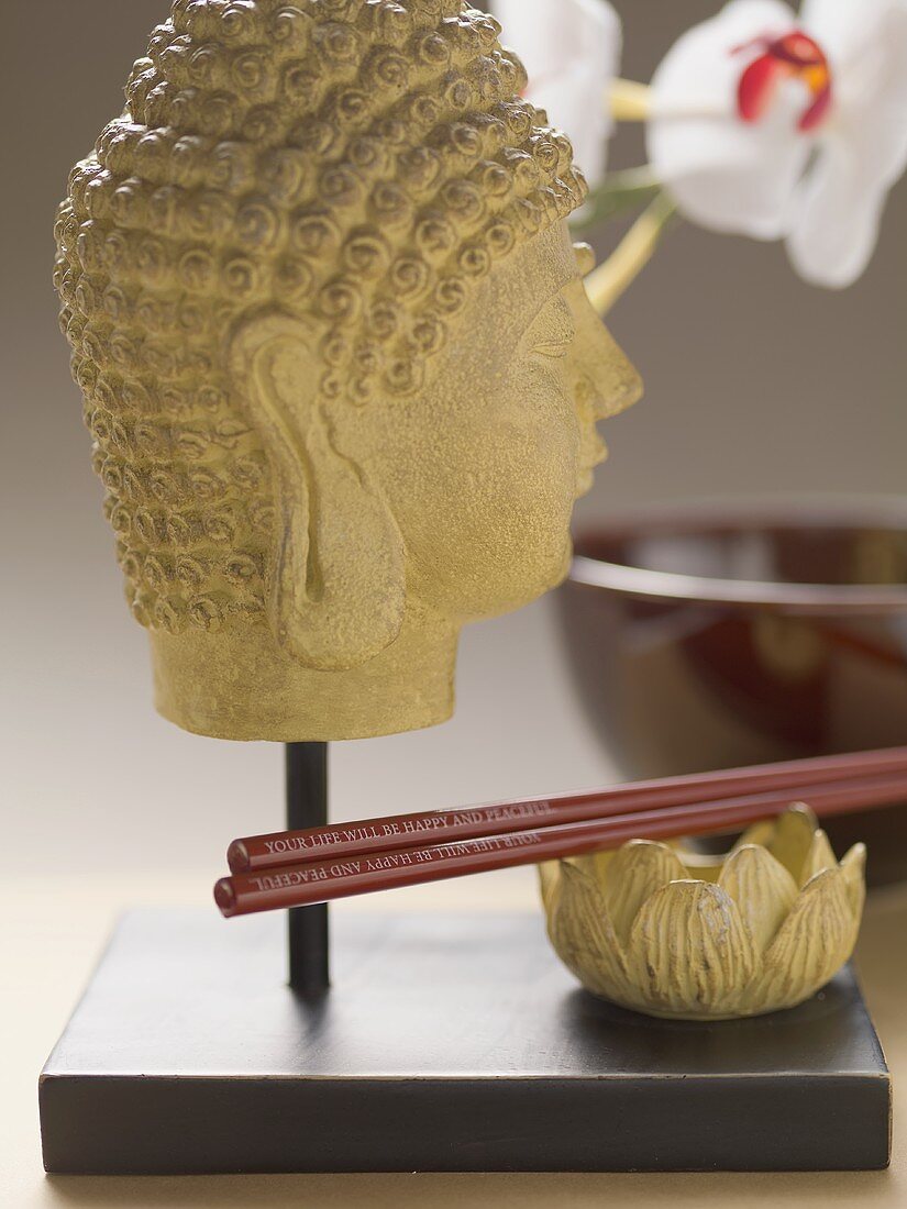 Buddha head and chopsticks