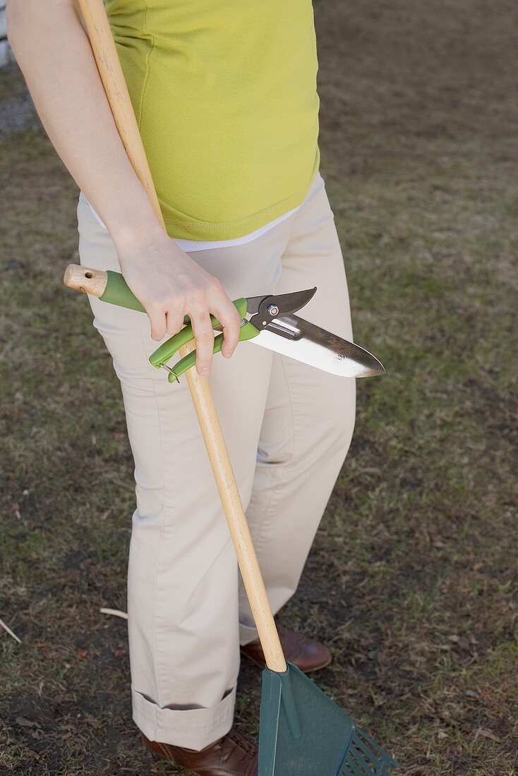Woman with garden tools