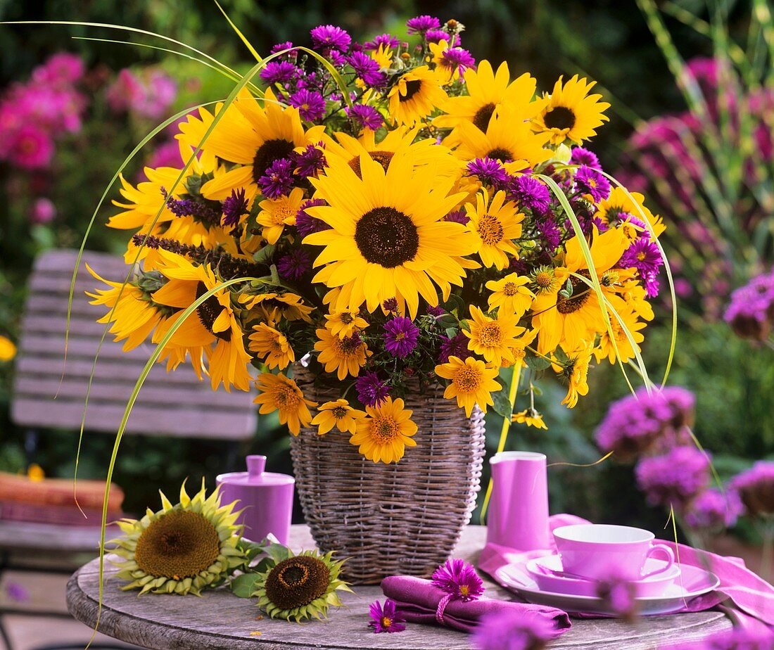Arrangement of sunflowers with Michaelmas daisies