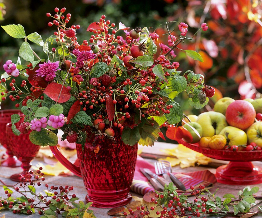 Arrangement of rose hips, raspberries and spindle berries
