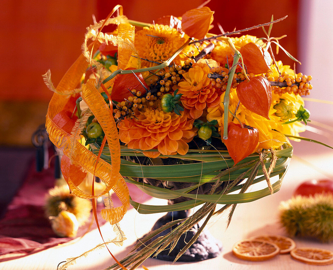 Autumn arrangement of dahlias, Chinese lanterns & sea buckthorn