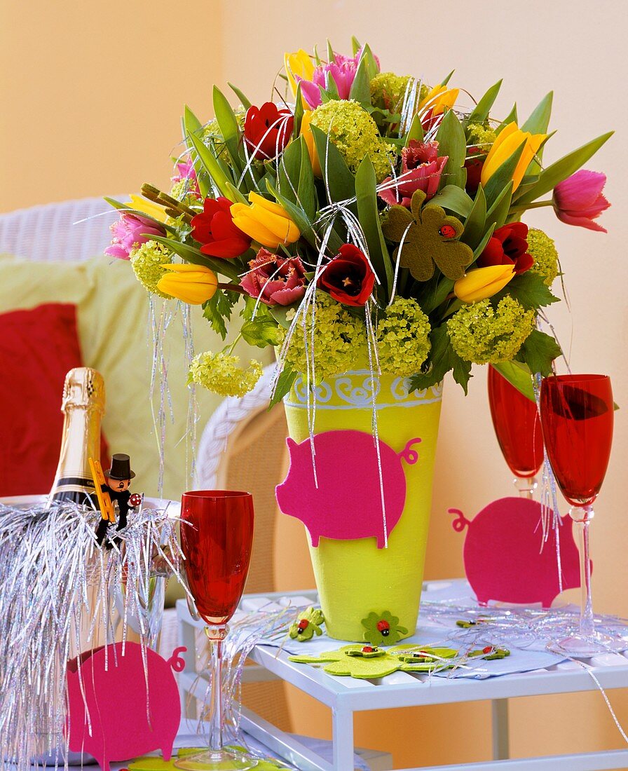 New Year’s Eve arrangement of tulips and Viburnum