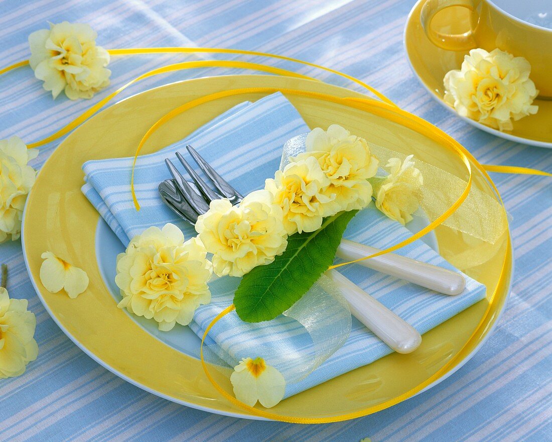 Place-setting decorated with primulas