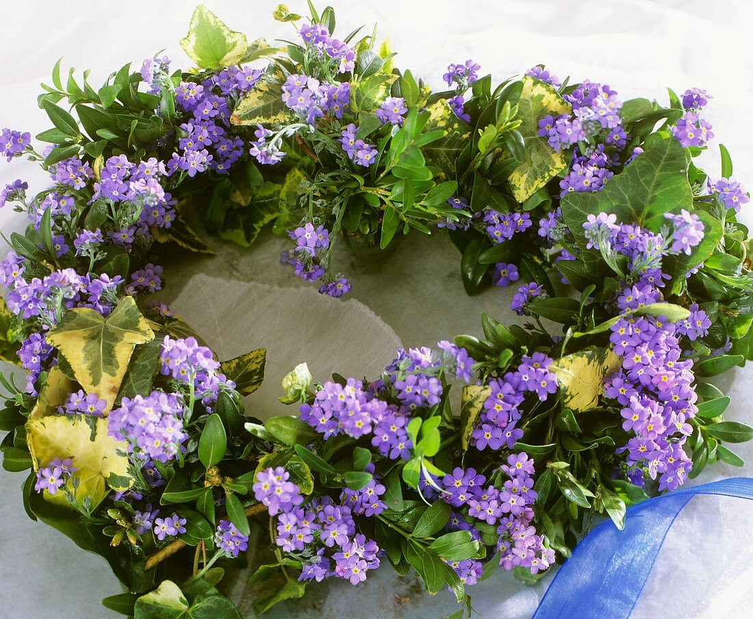 Heart-shaped wreath of forget-me-nots, ivy and box