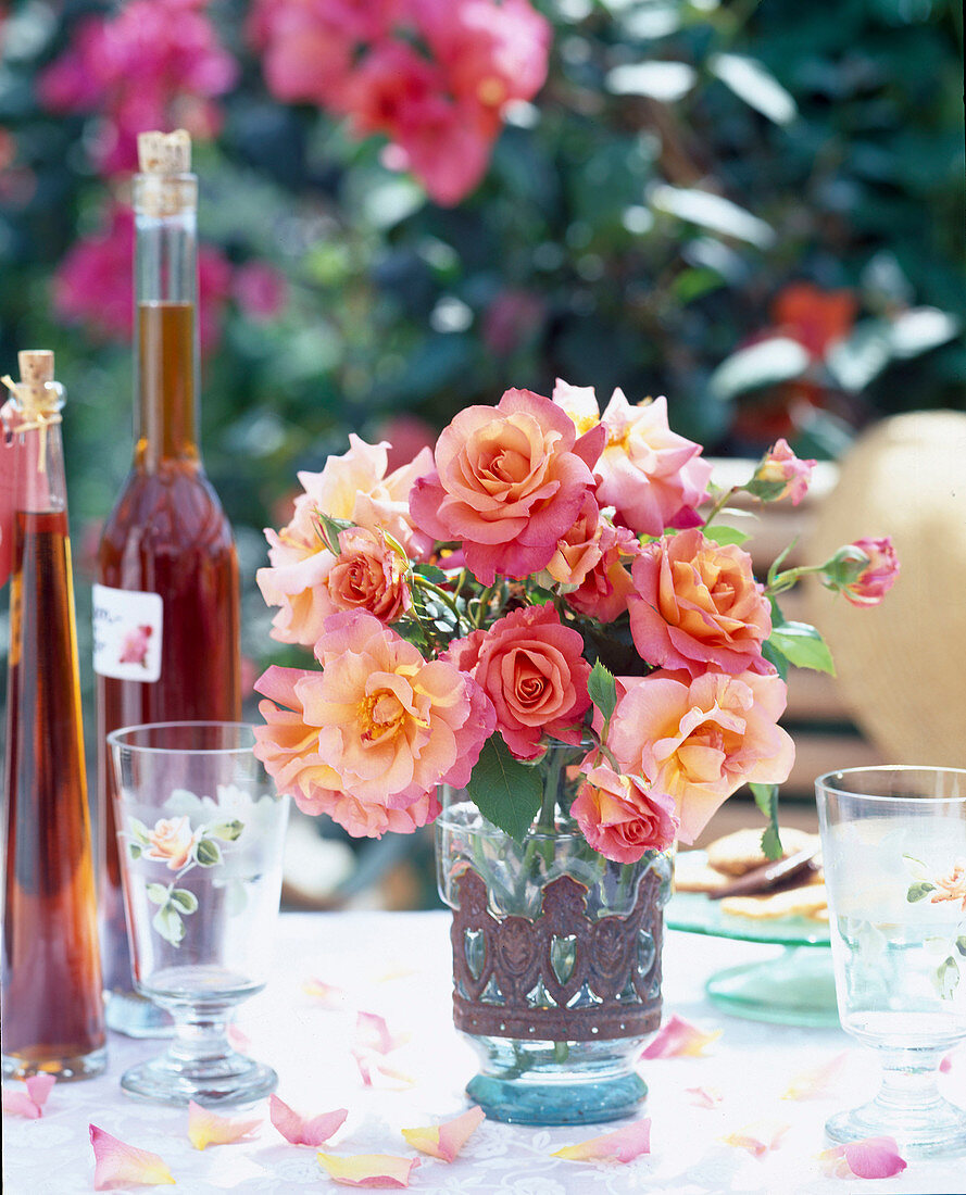 Vase of roses on a garden table