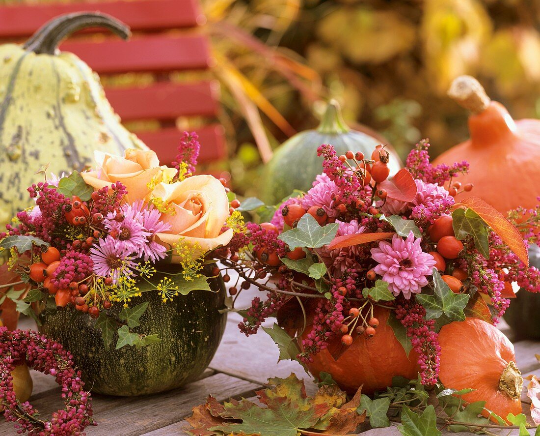 Two autumn flower arrangements in pumpkins