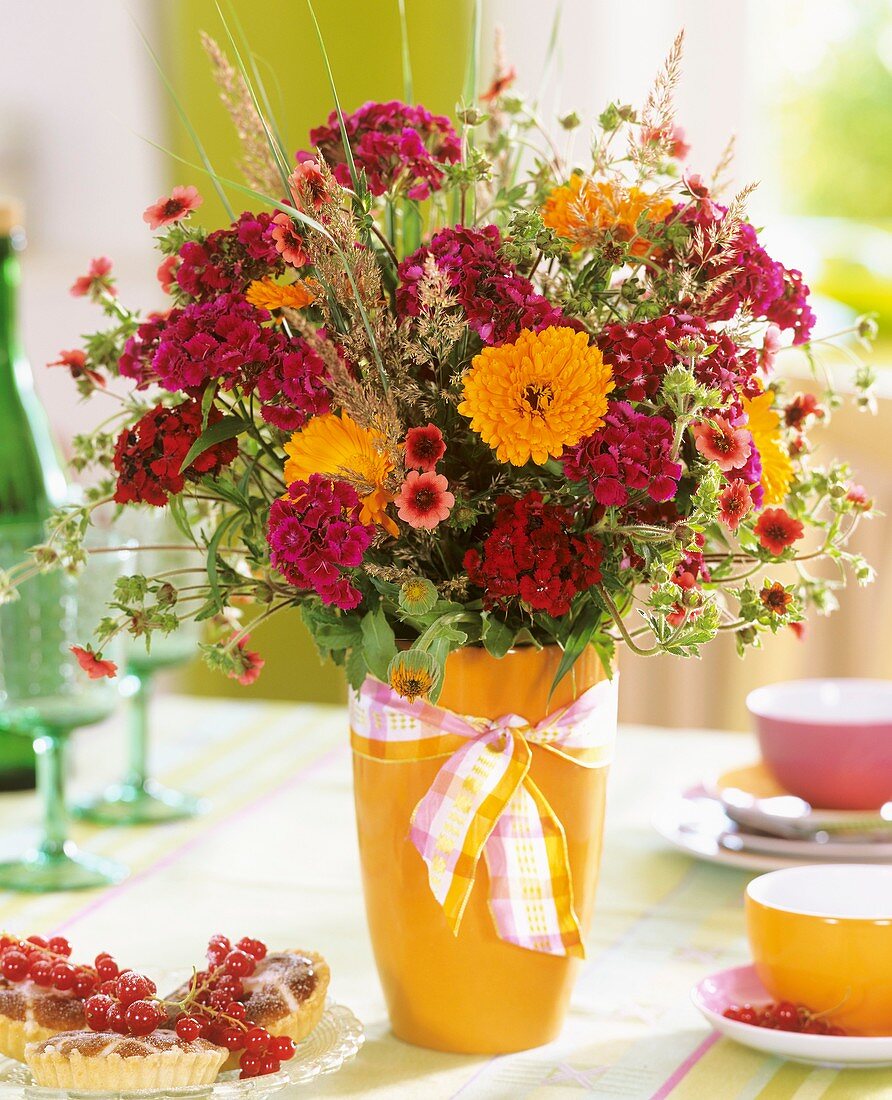 Vase of Sweet Williams, marigolds and Potentilla