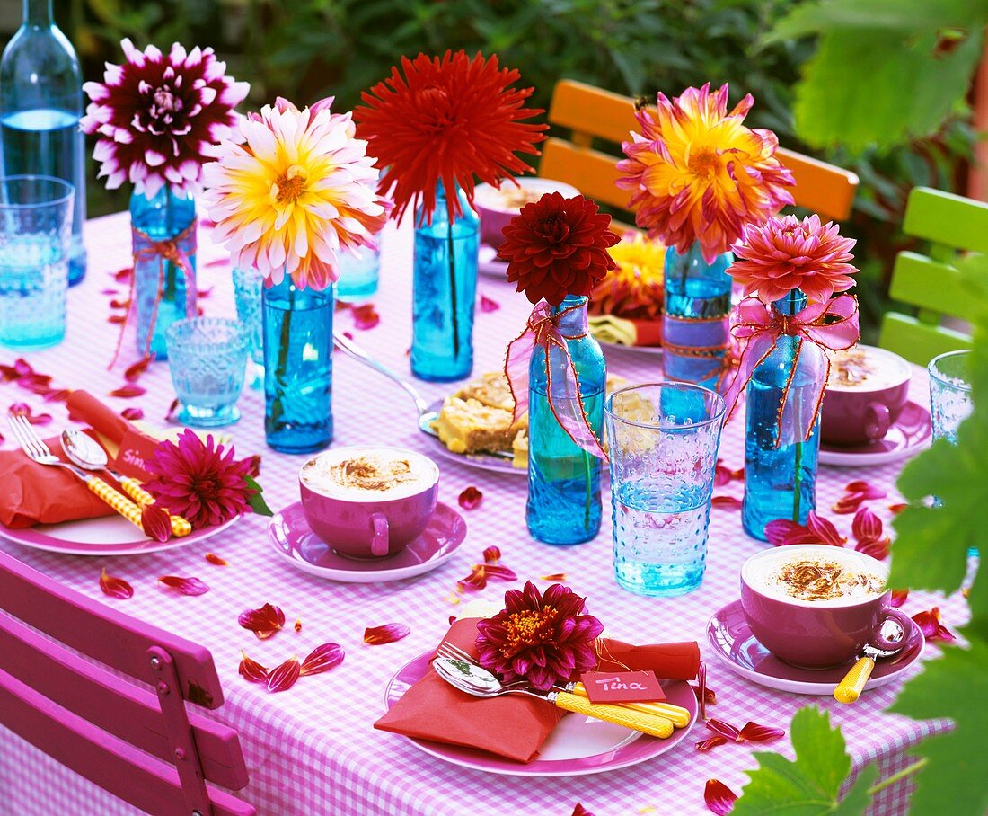 Dahlias in blue bottles and on napkins
