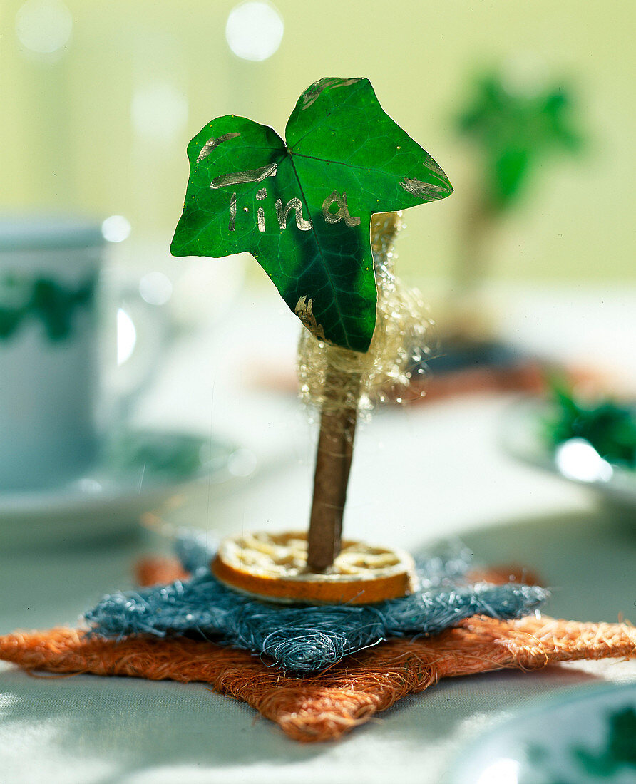 Ivy leaf place-card on a cinnamon stick