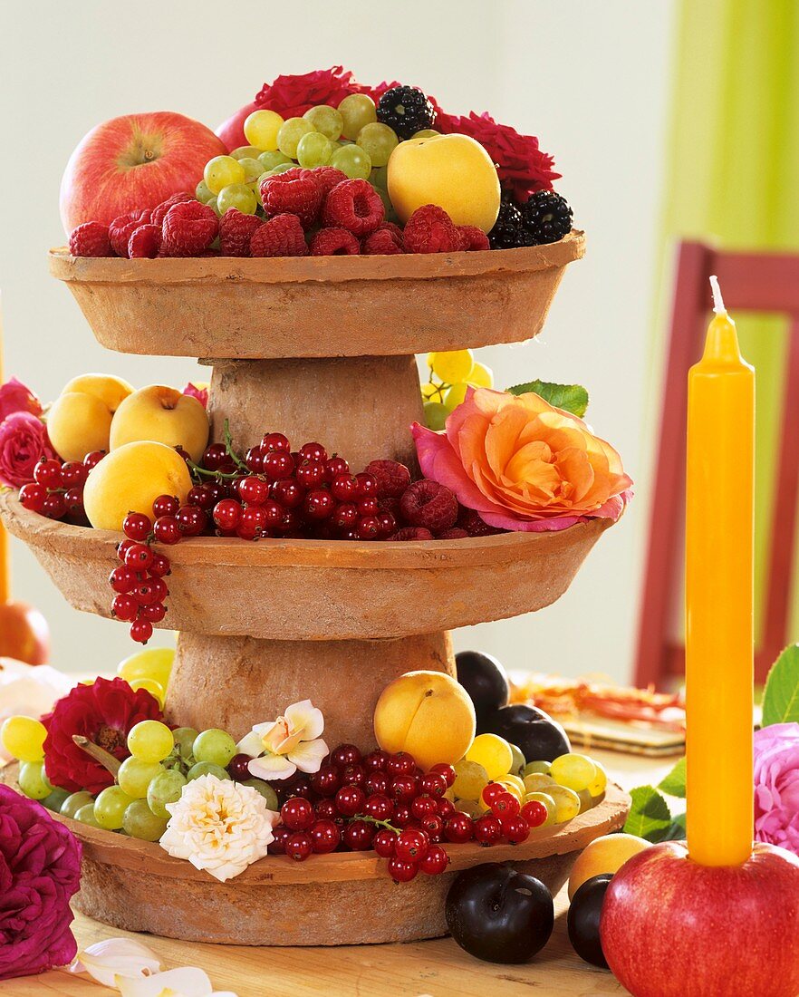 Home-made tiered stand with fruit and flowers