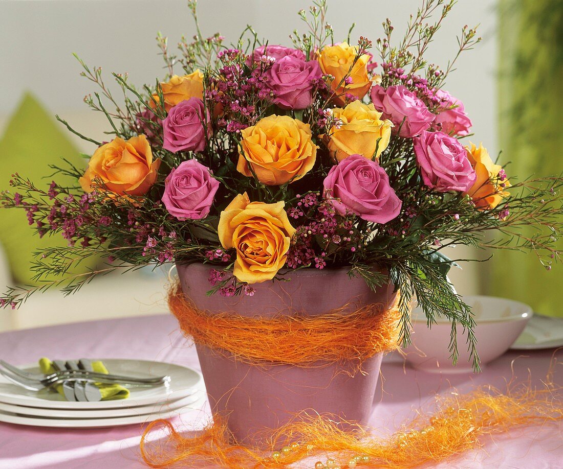 Arrangement of pink and yellow roses