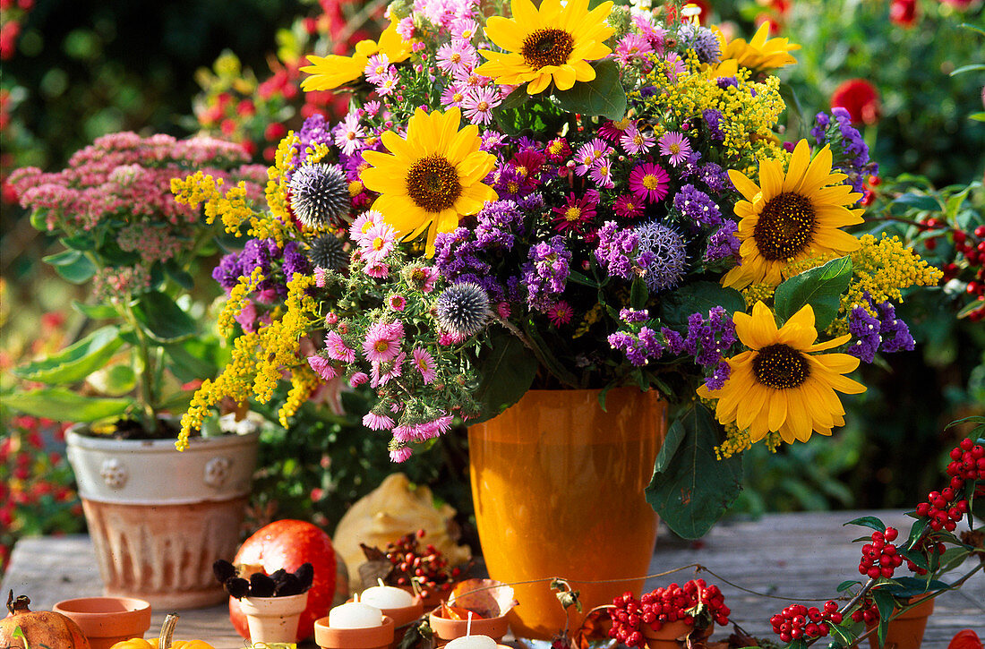Arrangement of sunflowers, Michaelmas daisies & golden rod