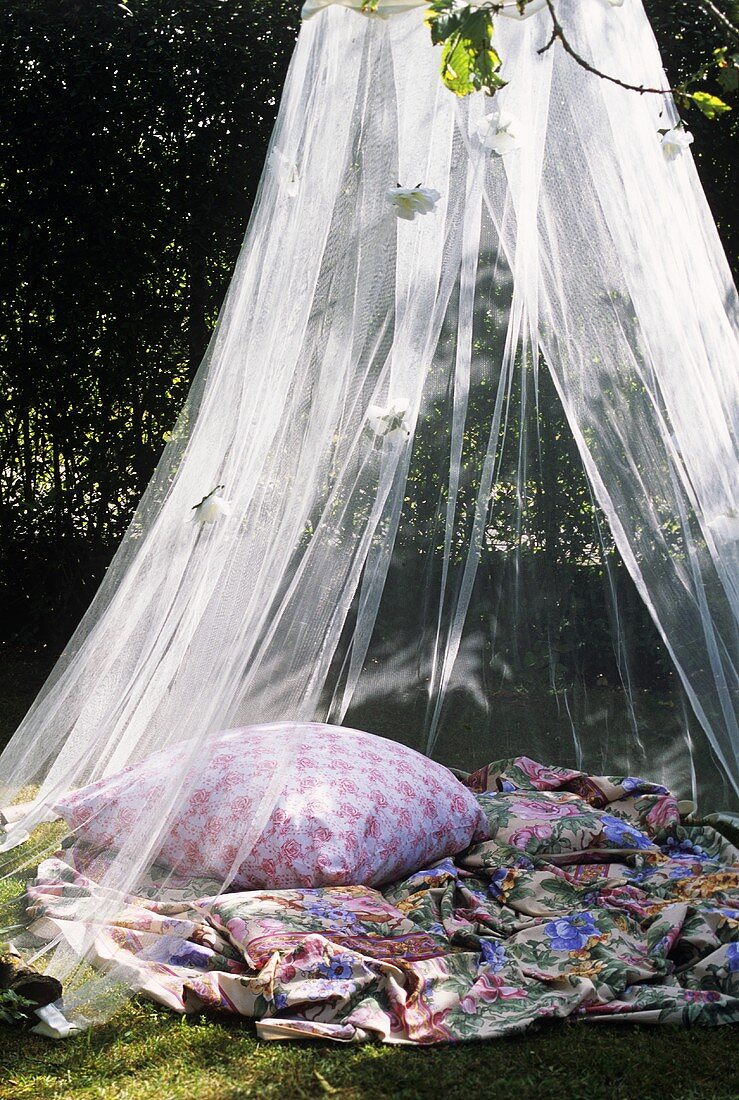 A place to sit under a mosquito net