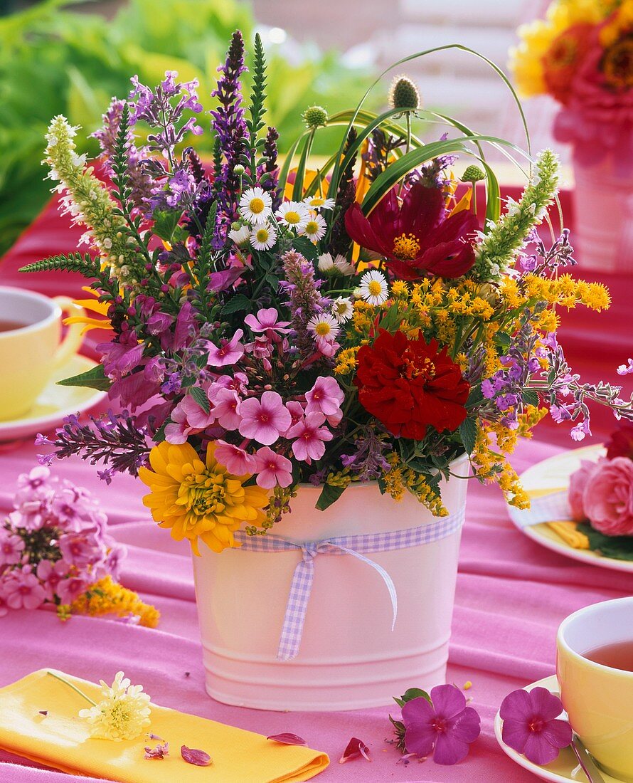 Posy of summer flowers on tea table