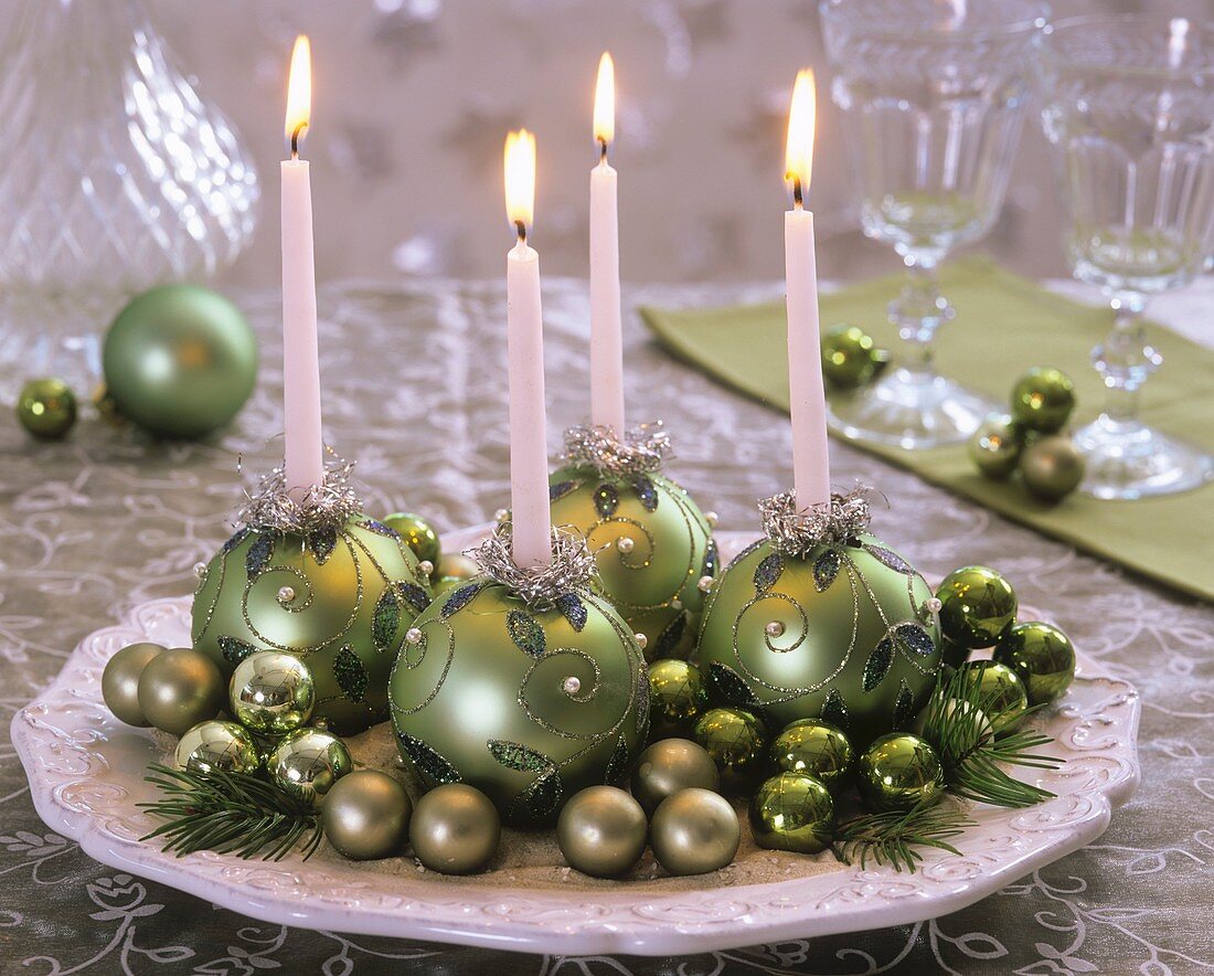 Advent wreath with green baubles as candle holders