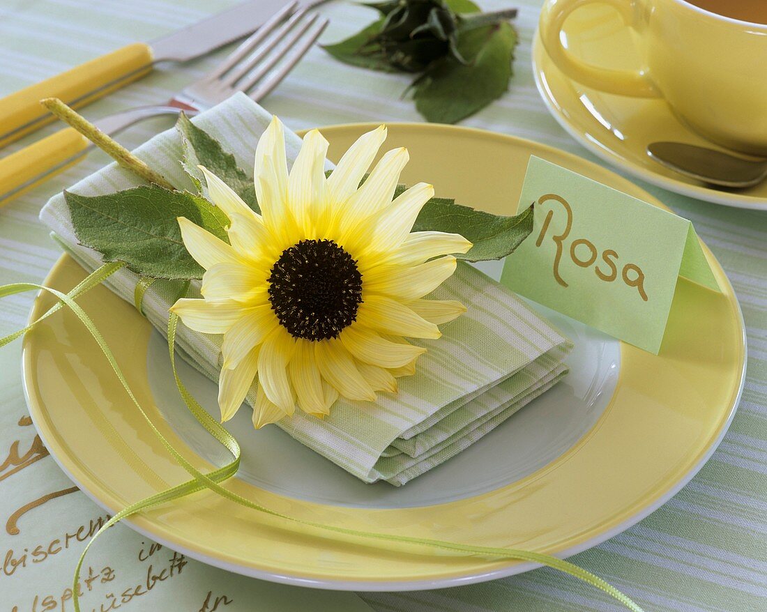 Place-setting with sunflower and place card