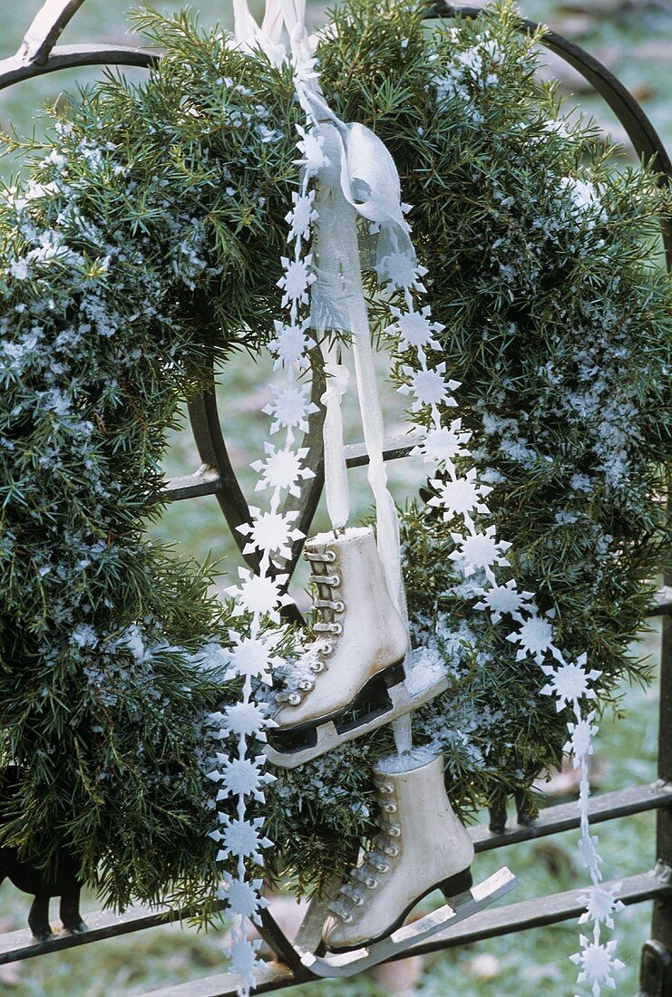 Evergreen wreath with ribbon and skates
