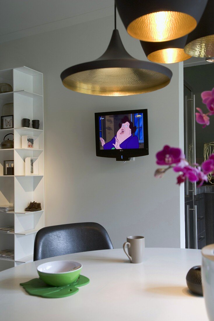 Interior with TV, dining table & shelving