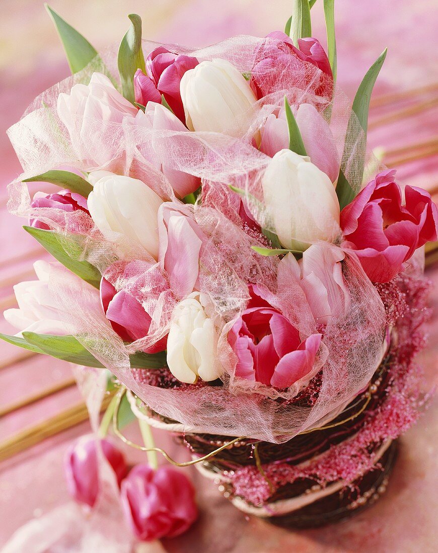Arrangement of white and pink tulips
