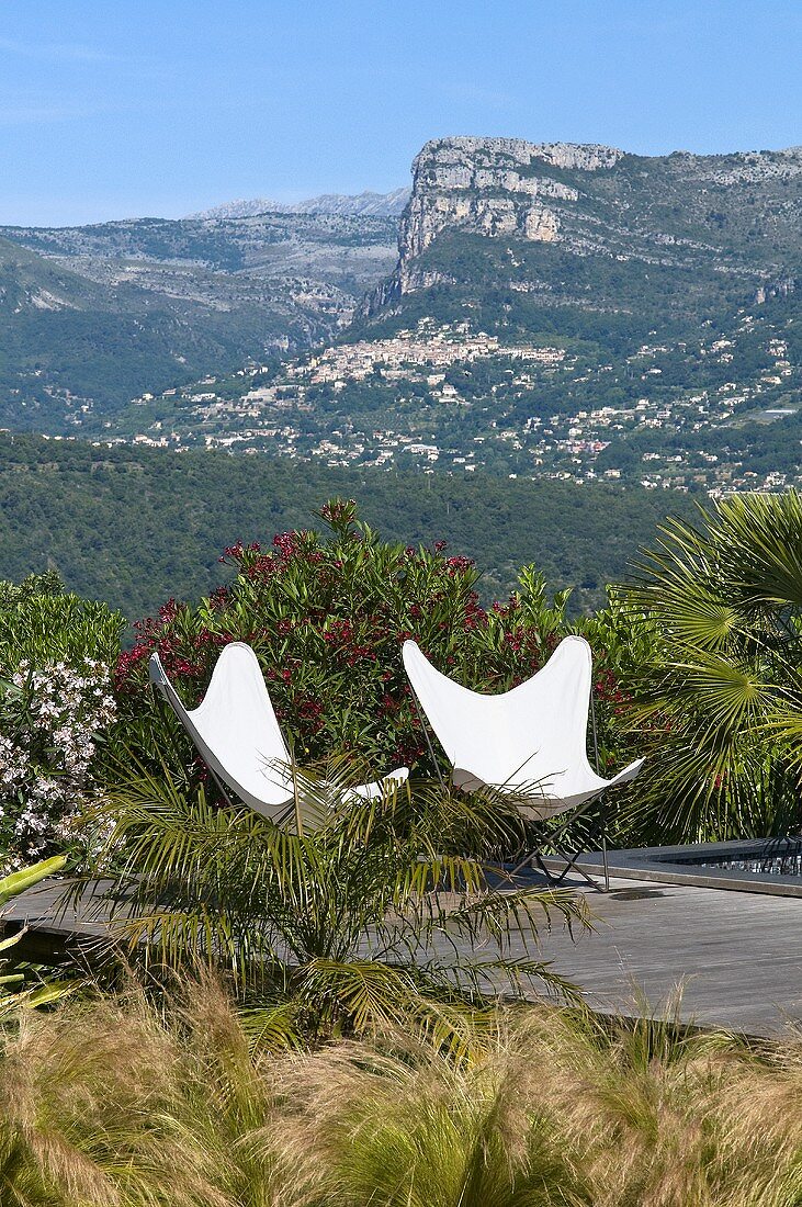 Designer chairs by swimming pool (Villa Nalu, Southern France)