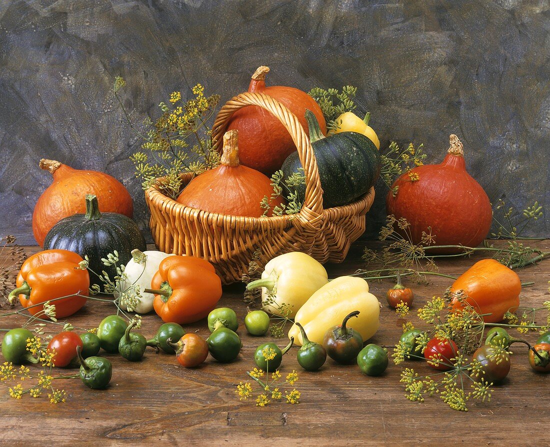 Various types of pumpkins and peppers