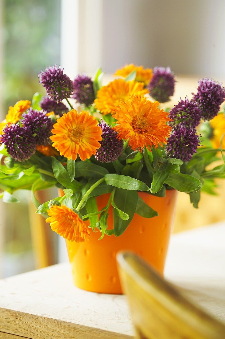 A posy of chive flowers and marigolds