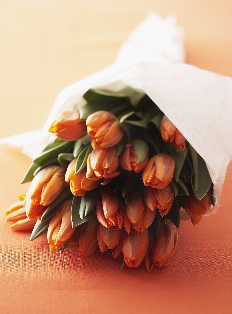 A bunch of tulips wrapped in paper