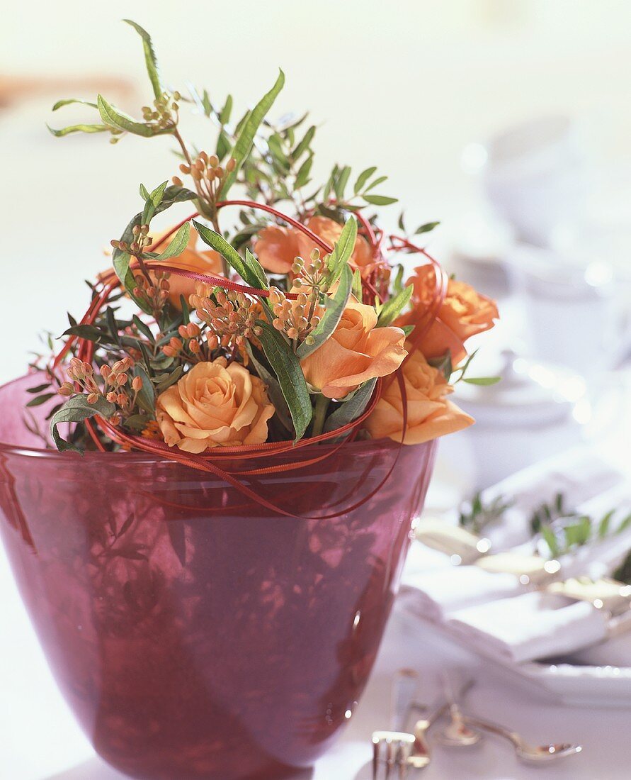 Bridal bouquet of roses, pistachio foliage & Asclepia