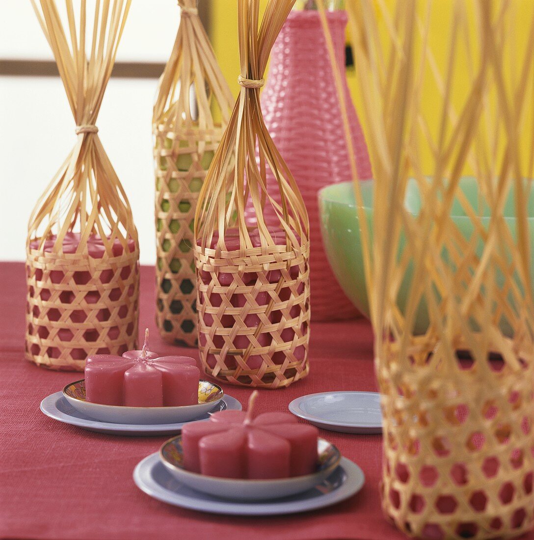 Flower candles in woven baskets