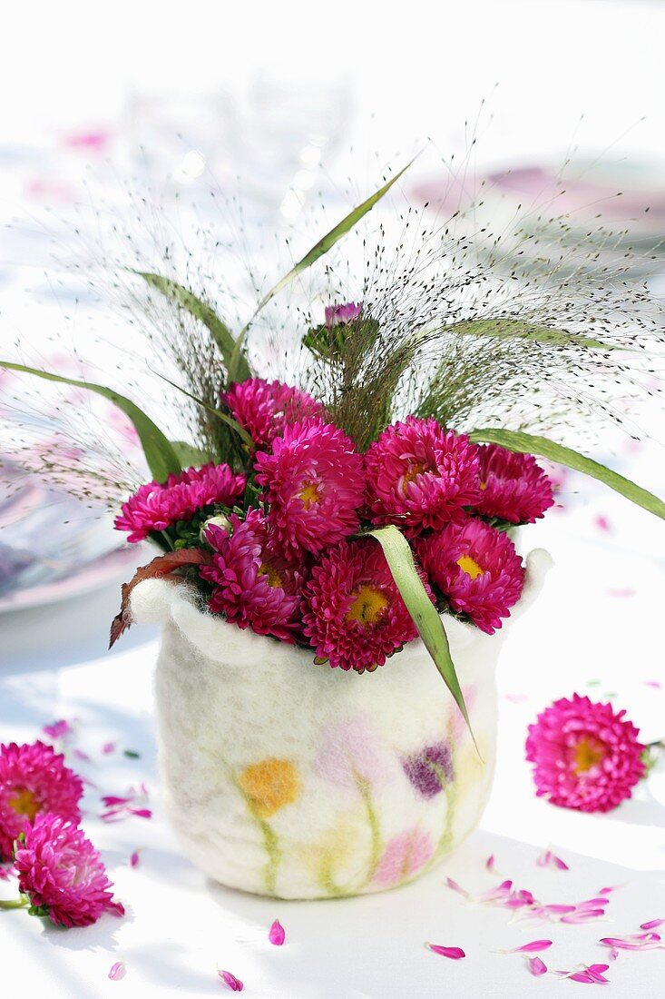 Asters and millet in felt vase