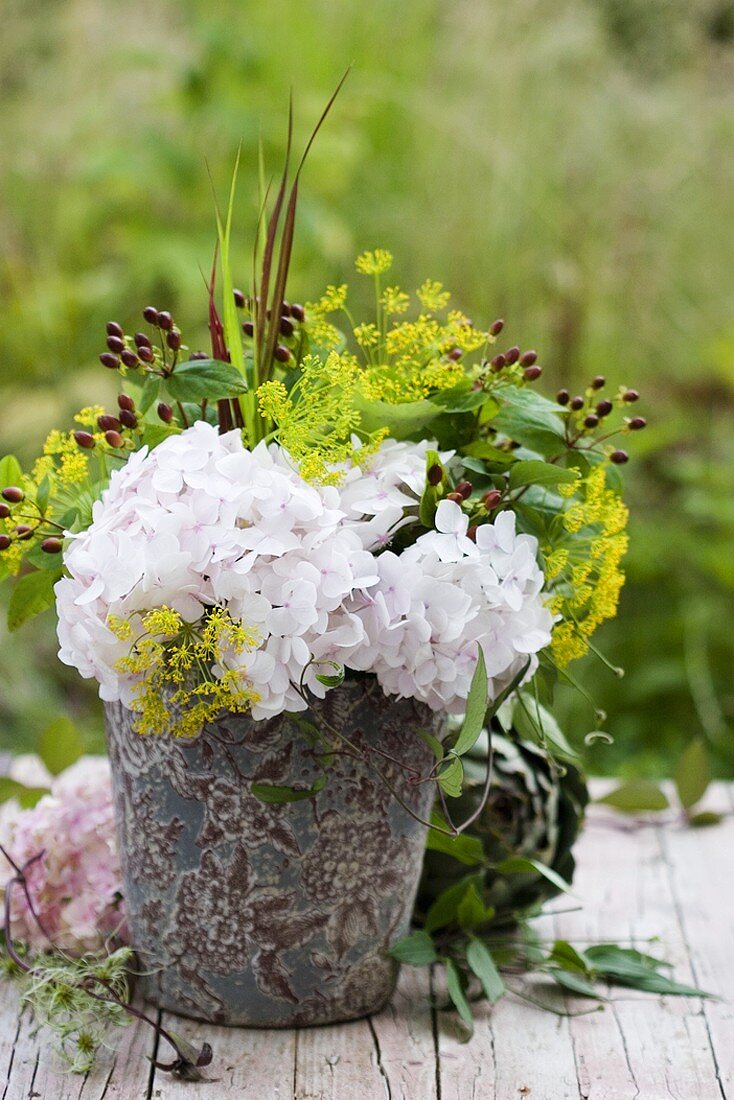 Hydrangeas, dill and St. John's wort in vase