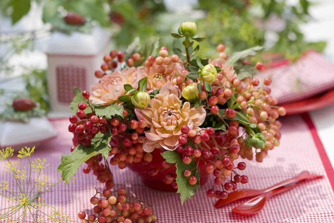 Posy of guelder rose berries & dahlias (table decoration)