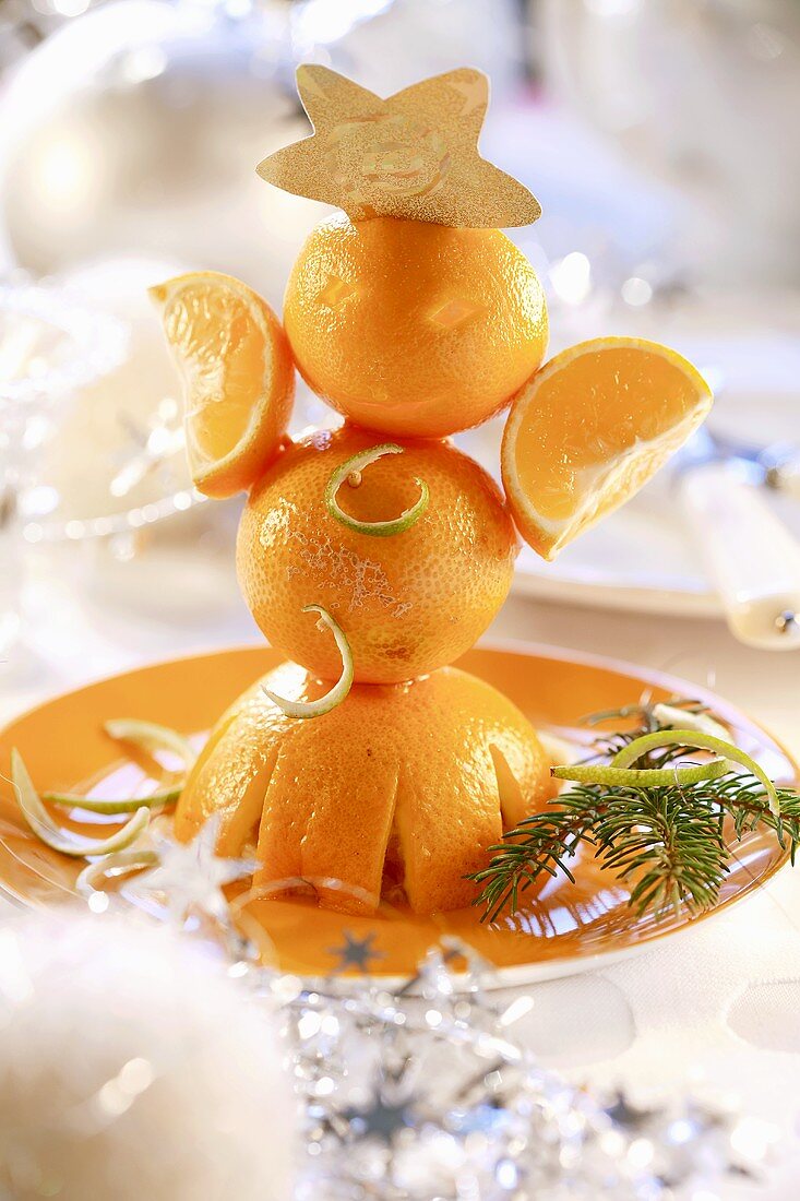 Christmas decoration: little man made from oranges