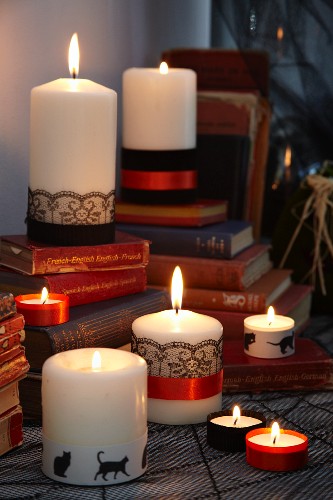 Candles decorated with ribbons and trim for Halloween